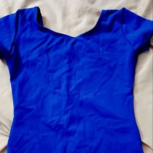 Girl's Capezio short sleeve royal blue dance leotard. Medium